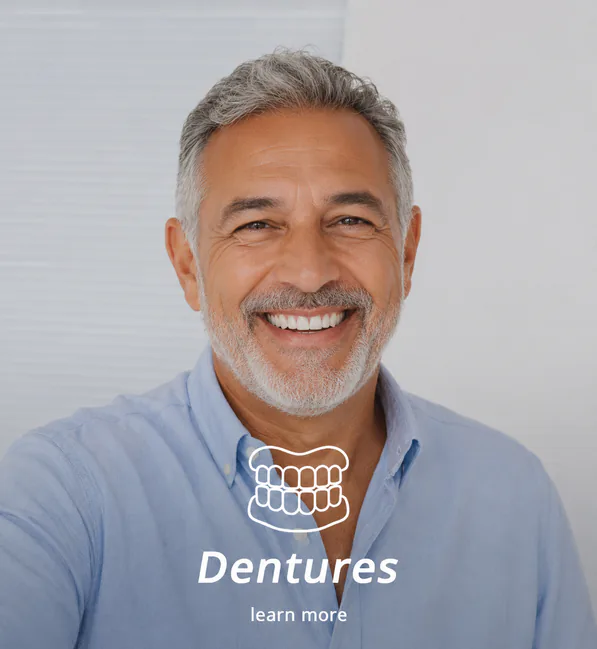 Older man smiling with dentures